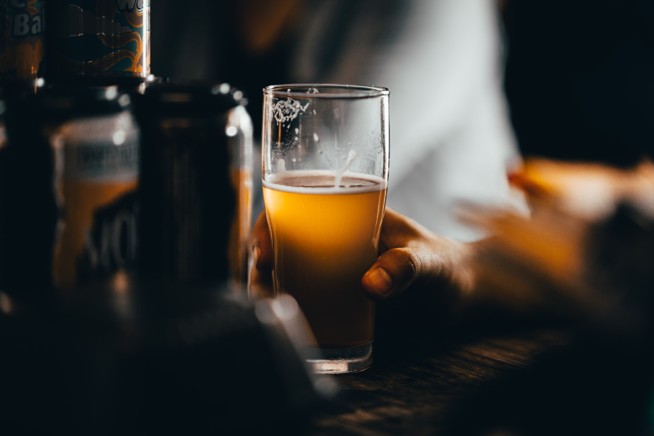 Hand Holding Pint of Beer